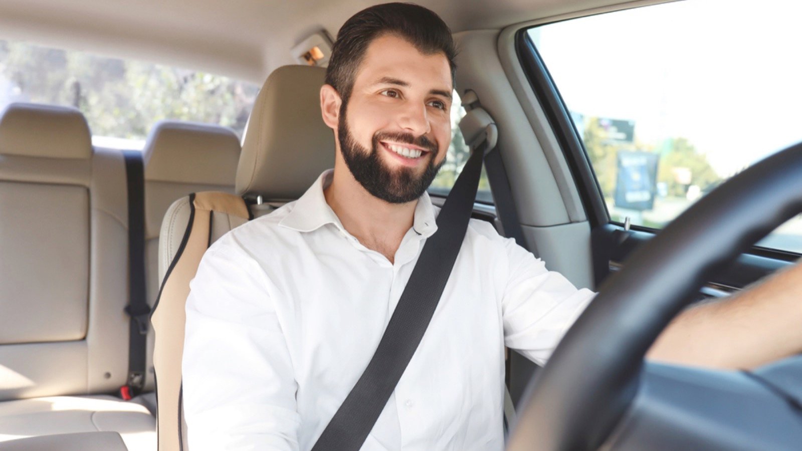 Man happily driving car