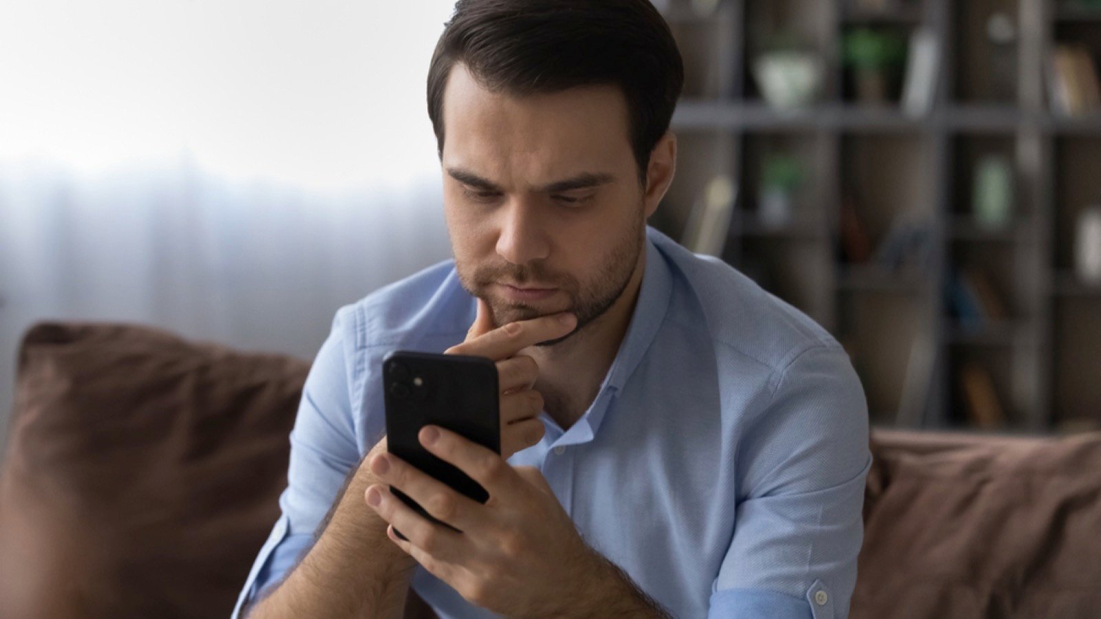 Man using mobile for research