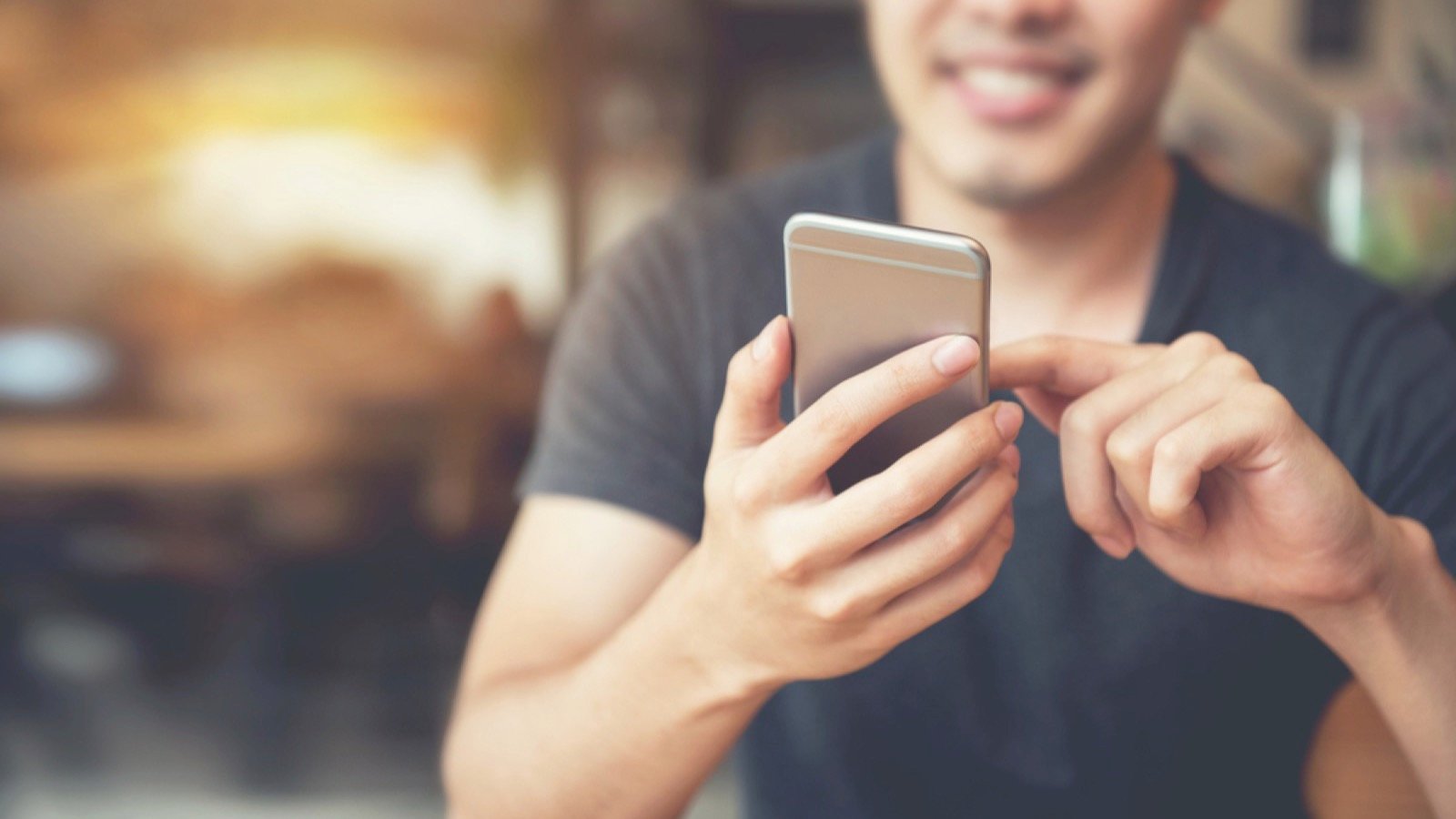 Man using mobile reviewing plan