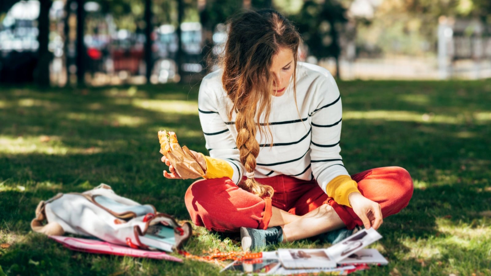 Woman eating homemade food in picnic