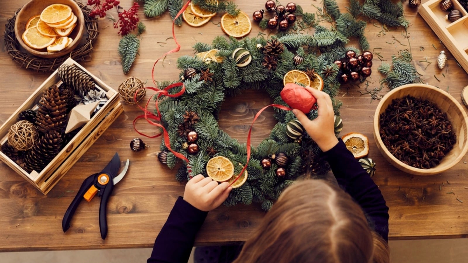 Woman making Christmas wreath