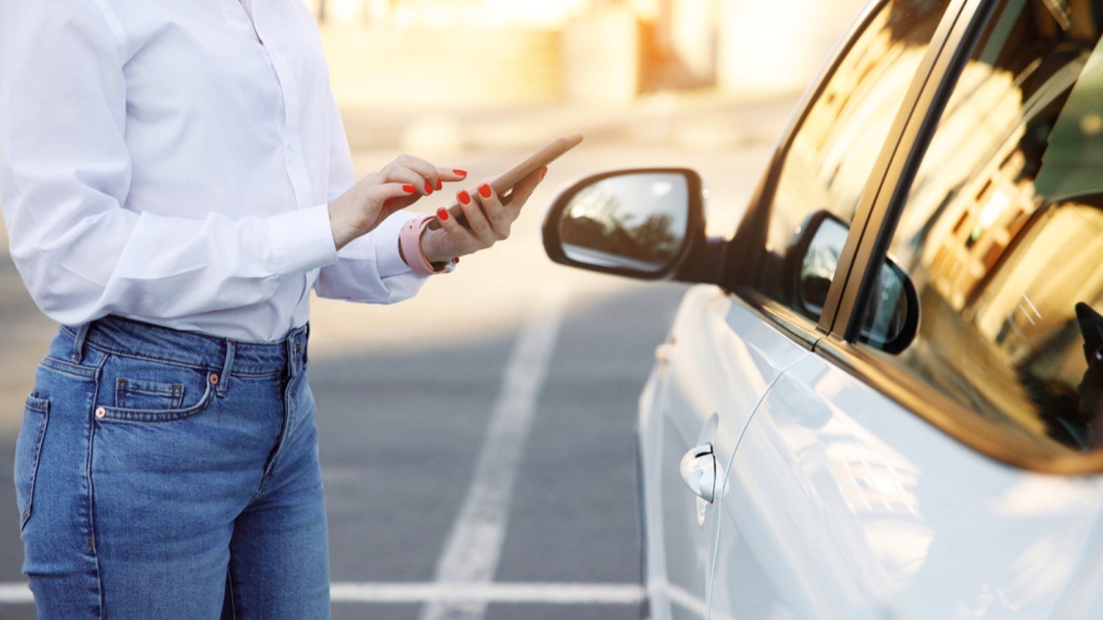 Woman standing near car