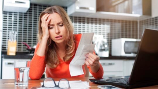 Young woman tired of seeing credit card bills