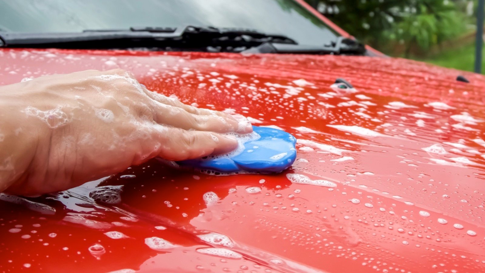 Man cleaning car