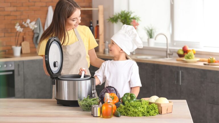 Mother and daughter preparing a family meal in the crockpot