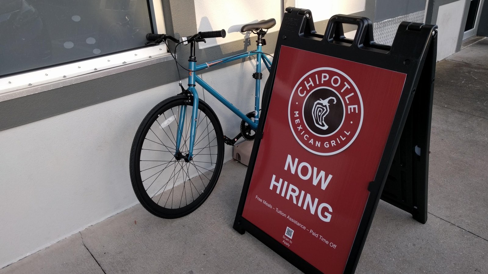 NOW HIRING sign for Chipotle