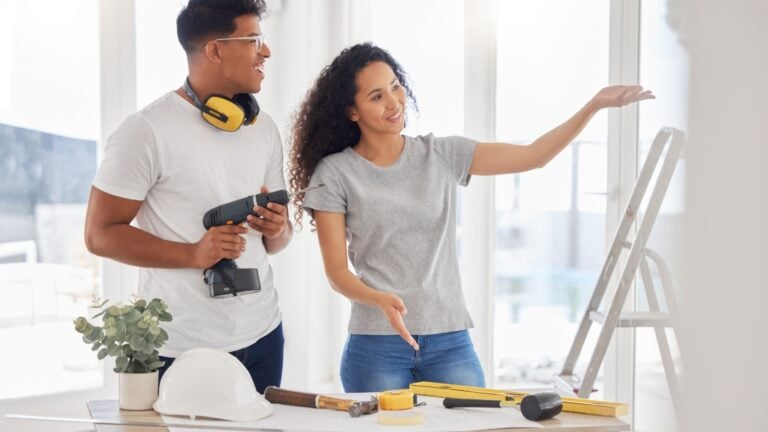 Young couple planning DIY in their home