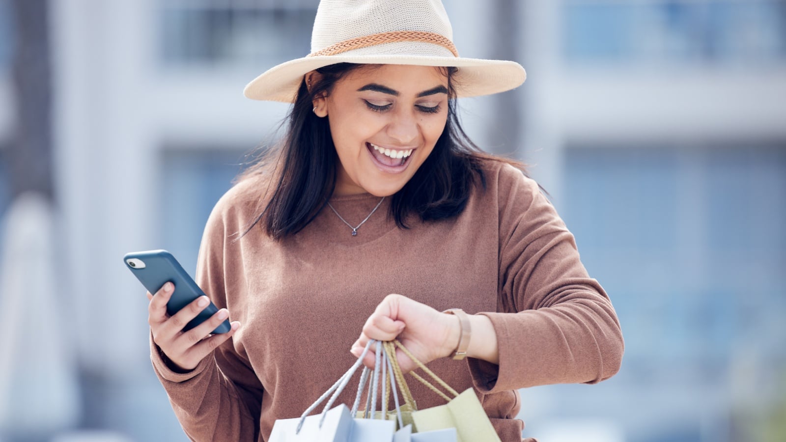 Young woman shopping with a time limit looks at her watch