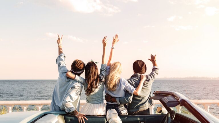 Group of friends on a road trip to the coast
