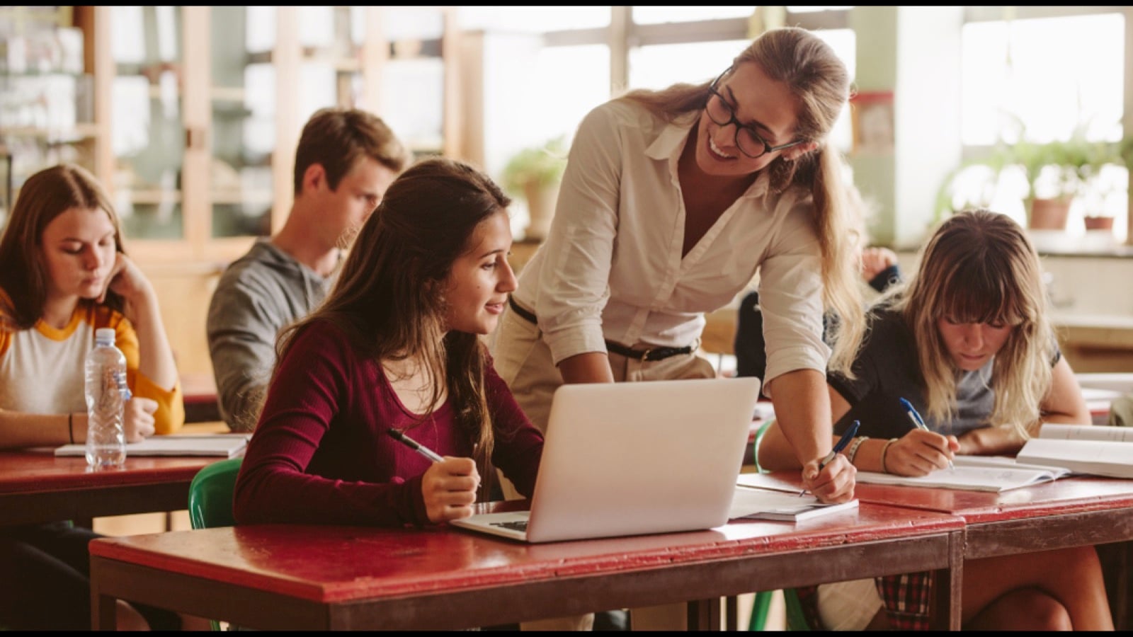Teacher with high school students