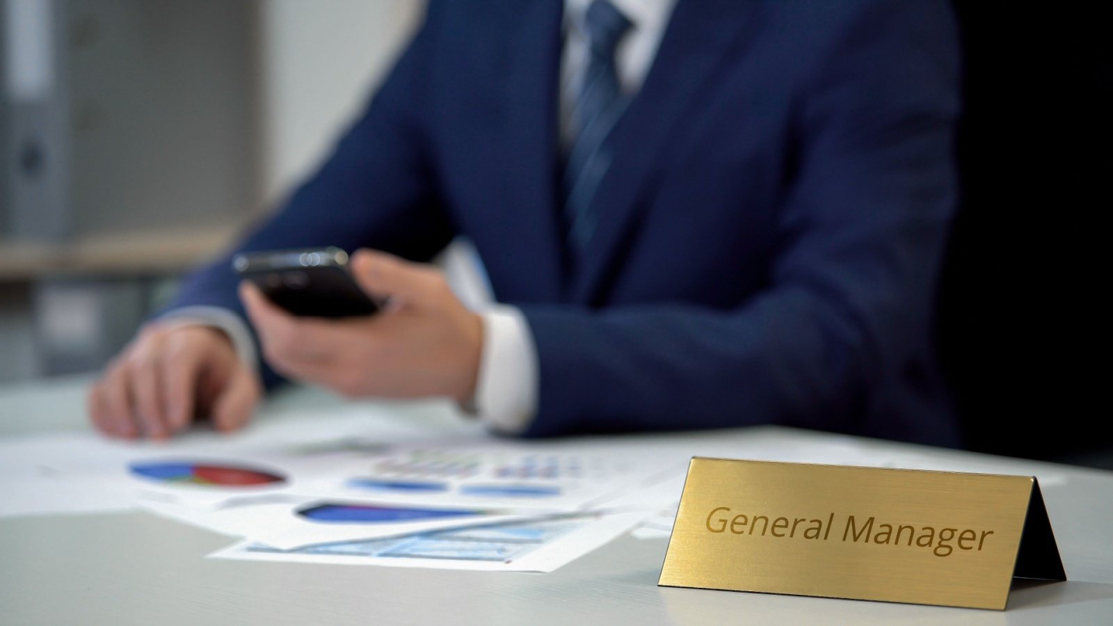 General Manager on the desk of worker