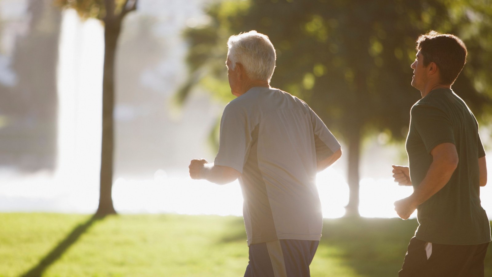 Retiree Personal Trainer jogging with a younger man