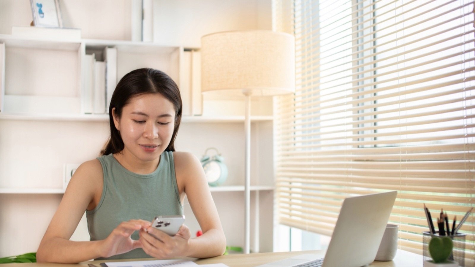 Woman using mobile for saving and budget