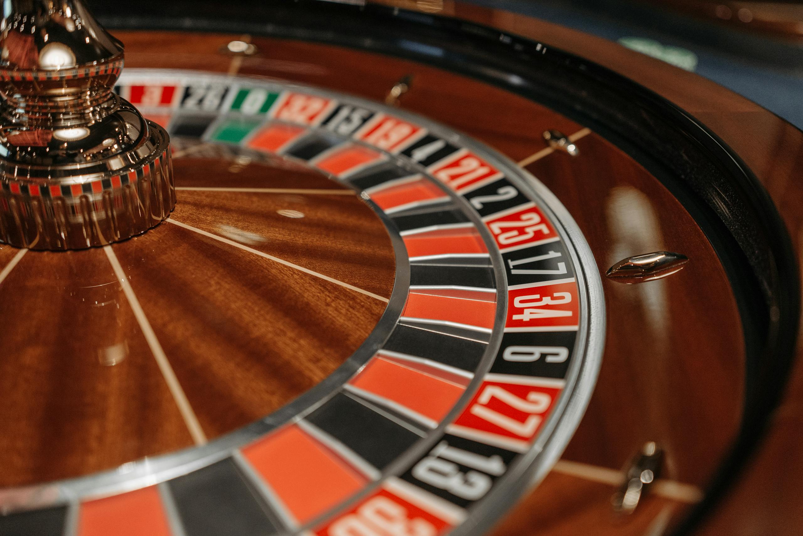 Investing and Gambling Close-up of an elegant roulette wheel showcasing numbers and colors, ideal for casino themes.