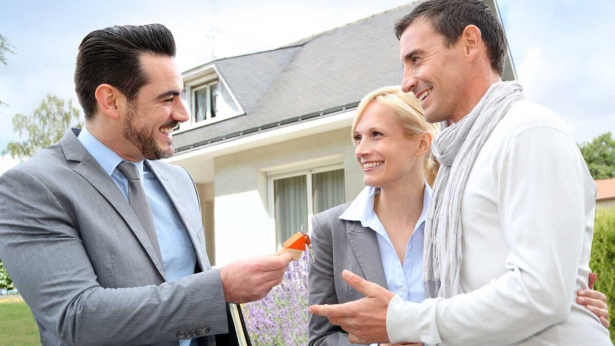 Couples buying house from real estate agent