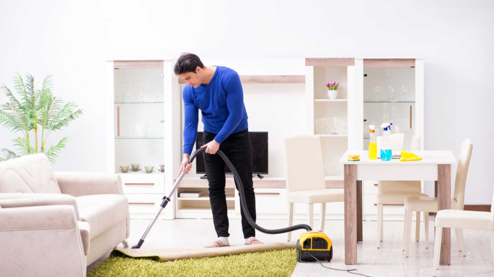 Man vacuuming