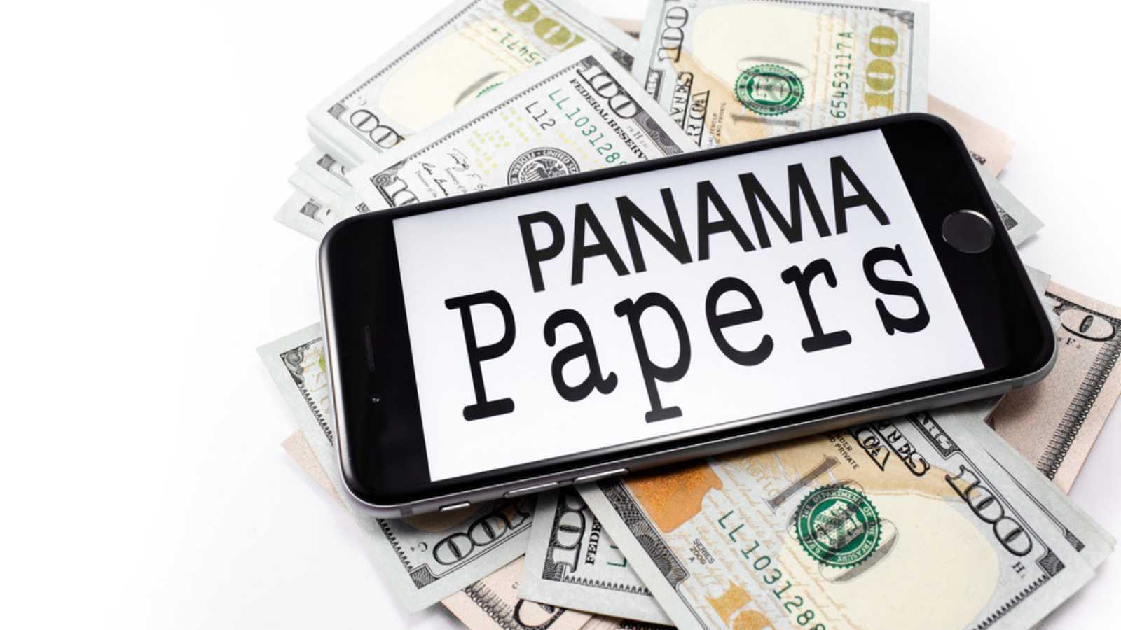 Brand black Apple iPhone 6s with text Panama papers on the screen, with money, dollar. Chelyabinsk, Russia - April 14, 2016
