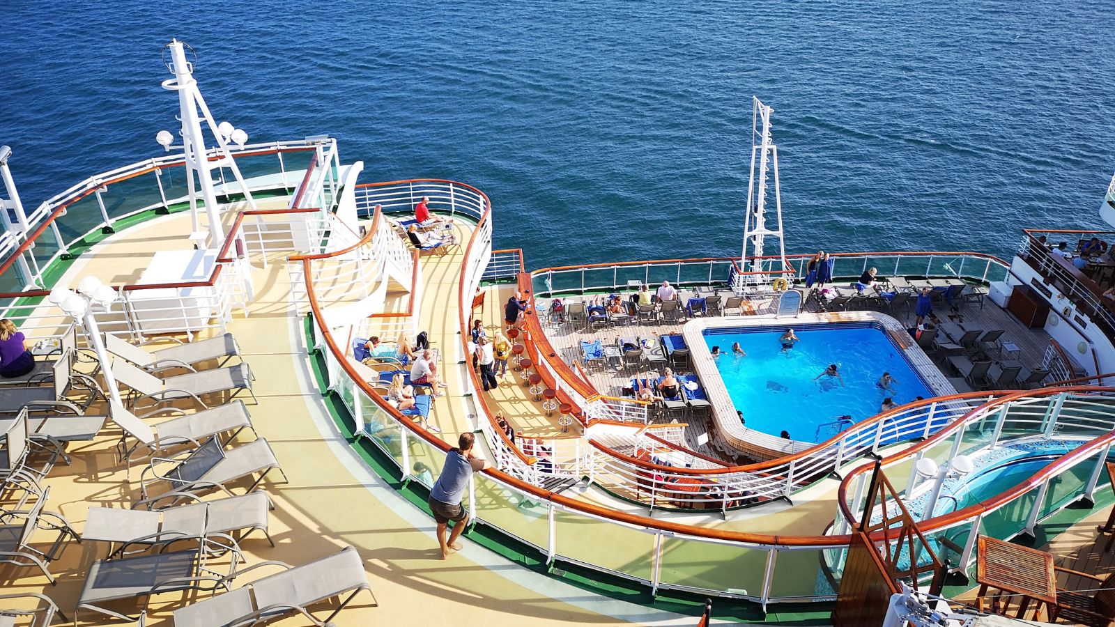 Passengers enjoying refreshments on an ocean cruise, channel islands, cruise, cruise ship, deck, documentary, editorial, enjoyment, getting away from it all, guernsey, hand rail, holiday, idyllic, journey, leisure activities, luxury, nautical vessel, ocean, ocean liner, p&o, passenger, passenger craft, passenger ship, poolside, railing, relaxation, safety, sailing, sea, ship, ships at sea, ships deck, southampton, summer, sunny, swimming pool, tourism, tourist, tourist resort, tranquil scene, transport, transportation, travel, tropical climate, upper deck, vacation, ventura, vessel, voyage, wanderlust