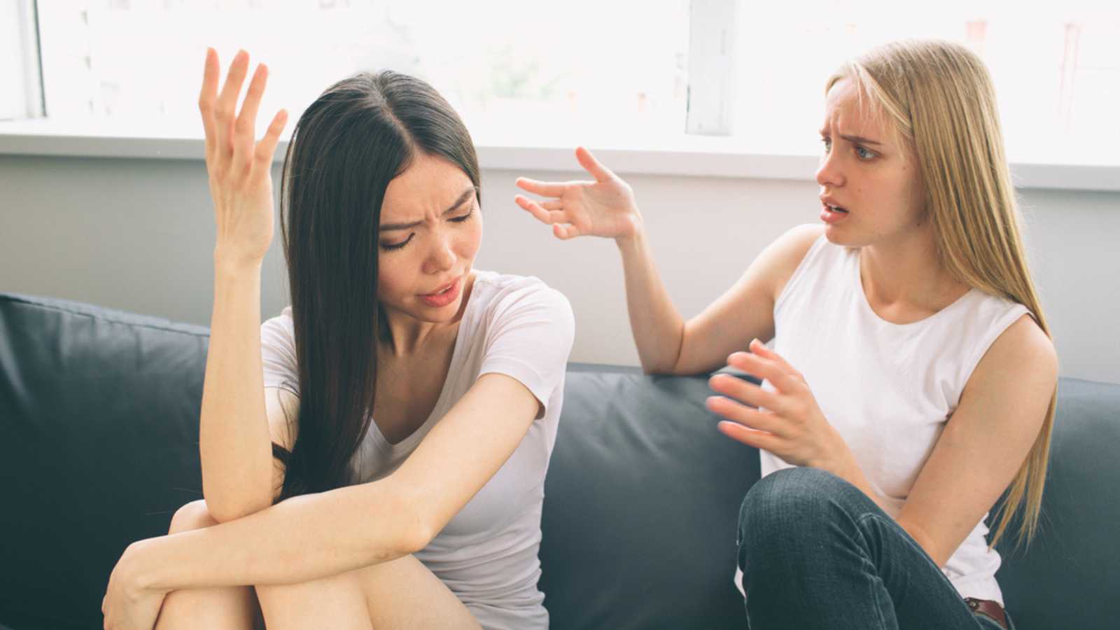 girls quarrel. Women talking loudly about something.