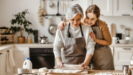 girl baking with grandmother