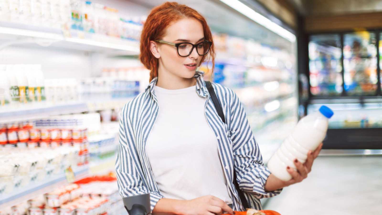 Woman buying milk