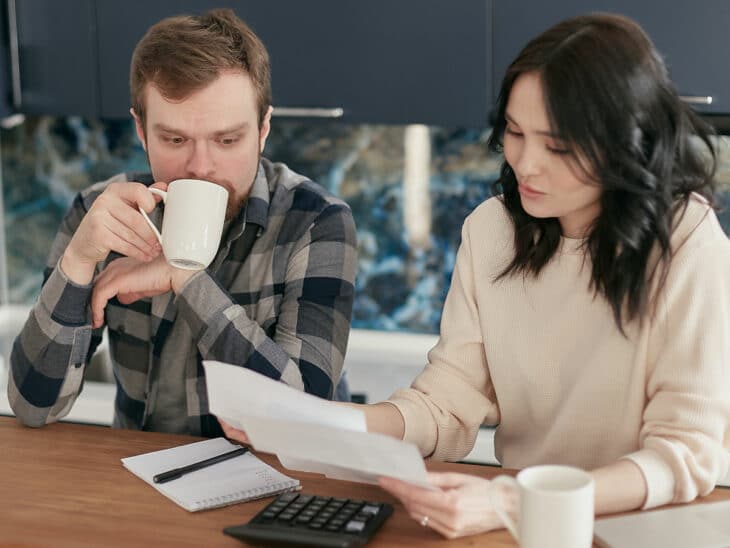 Couple reviewing credit card bills.