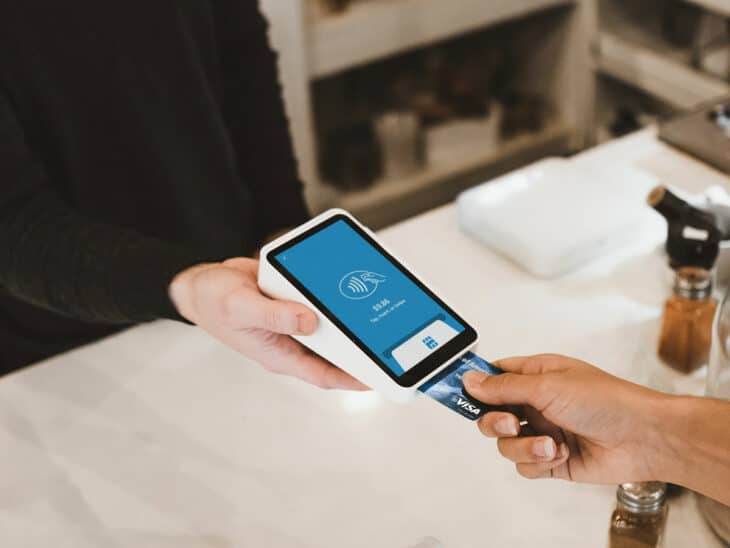 Paying for a purchase with a credit card.