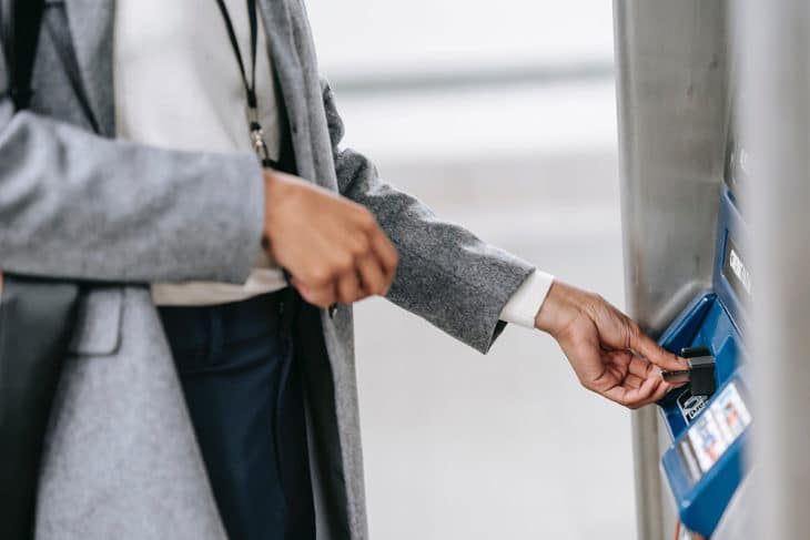 Woman withdrawing cash at an ATM.