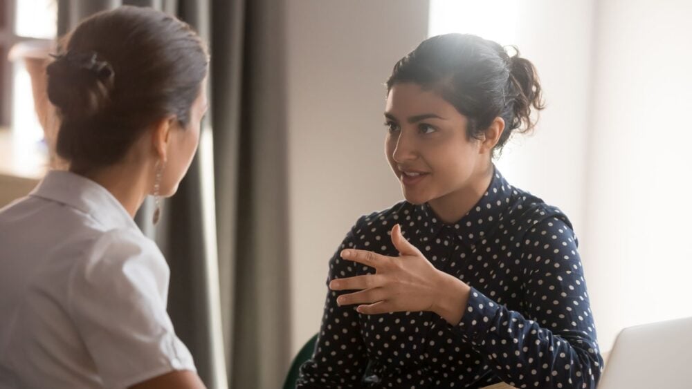 woman talking with another woman, advice support, apprentice training, assistance concept, boss looking, brainstorm ideas, break room, business coordination, caucasian businesswoman, client speak, coach trainer, coaching mentoring, collaboration partners, colleague discussion, company share, consult employee, cooperation teamwork, corporate instructing, creative entrepreneur, customer solutions, ethnic lady, executive listening, financial guidance, focus laptop, girl chatting, help together, indian startup, information interview, internship intern, job education, leader strategy, learn work, manager explain, marketing millennial, mate supervisor, meeting staff, multicultural conversation, multiethnic student, office coworker, people prepare, person project, personal teammates, plan table, professional trainee, relationship communicate, sales worker, service team, smart workplace, talking woman, teacher